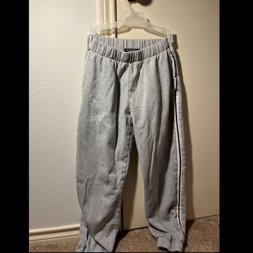 Brandy Melville Grey Sweatpants. White and Black Striped on sides. One Size.